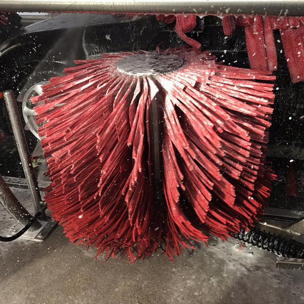 Rocker brush spinning in car wash